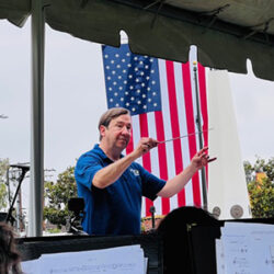 mike-stanley-conducting-in-front-of-large-us-flag02